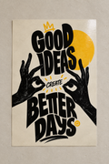 Hand-drawn hands framing the words GOOD IDEAS CREATE BETTER DAYS, with a yellow sun and crown, poster on a plain wall