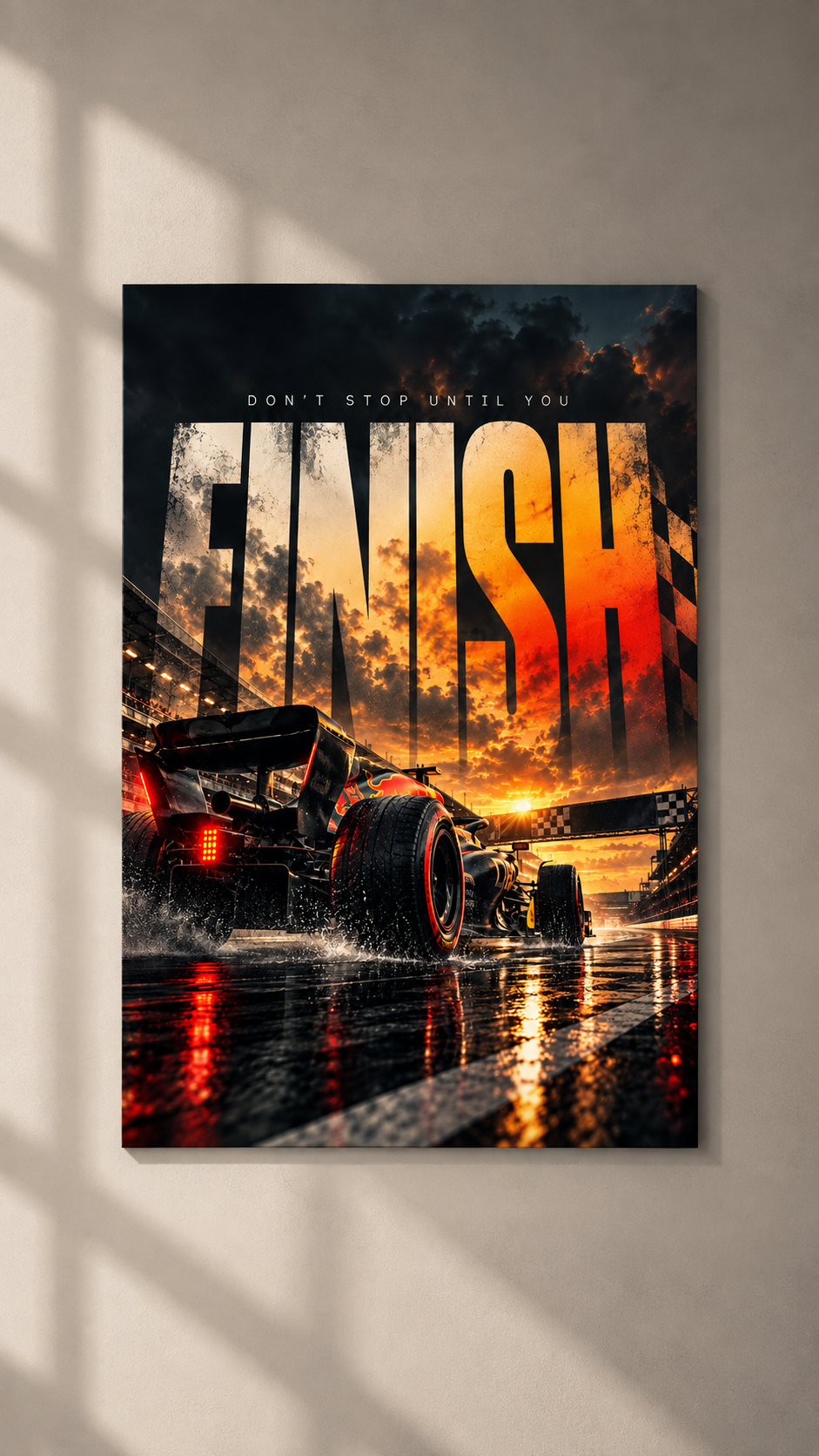 A formula race car speeding over a wet track at sunset, with FINISH in fiery lettering above, poster on a plain wall