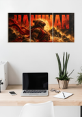 Hanuman in red and orange flames across three panels with large HANUMAN lettering, 3 piece split poster above a desk