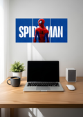 A red and blue masked hero in front of big white lettering on royal blue, across three panels, 3 piece split poster above a desk